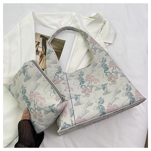 Detailed view of Chinese style jacquard fabric shoulder bag with floral embroidery