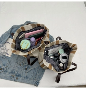 Overhead view of large canvas tote bag set showing spacious interior with daily essentials