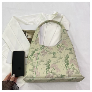 Detailed macro view of the light green floral jacquard fabric and delicate texture