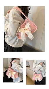Detail view of pink corduroy shoulder bag with large white bow and woven rope handle