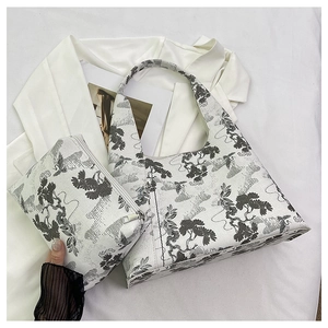 Detailed close-up of oriental embroidery tote bag set with crane and pine tree patterns