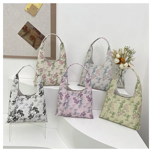 Group display of chic Chinese style underarm bags with floral and landscape embroidery