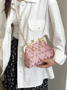 Pink heart-shaped evening bag with gold hardware and chain strap for women