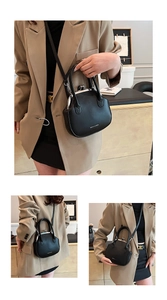 Detail of a black PU leather satchel with silver lock and Fashion & Bag printed text