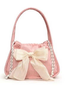 Pink corduroy handbag with a large organza bow and drawstring closure for women