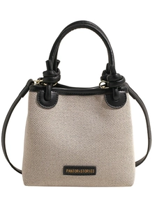 Schicke Tasche aus beigem Canvas und schwarzem Leder mit Knotengriff und langem Schultergurt