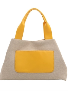Beige woven tote bag with yellow leather handles and front pocket decoration