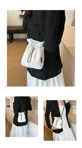 Close-up of lightweight nylon drawstring bucket bag with stylish checkerboard texture