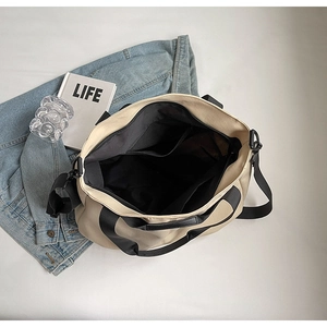 Top view of large canvas tote bag showing spacious black lining and interior pockets