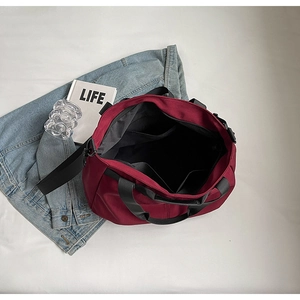 Interior view of large capacity tote bag with organized compartments and black lining