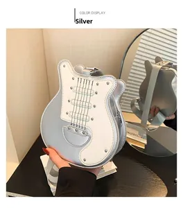 Detailed mirror view of a silver guitar-shaped shoulder bag with metallic PU leather finish
