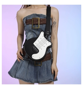 Detail view of electric guitar shaped crossbody bag featuring classic black and white finish