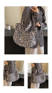 Detailed view of leopard print tote bag texture and wide canvas shoulder strap for women