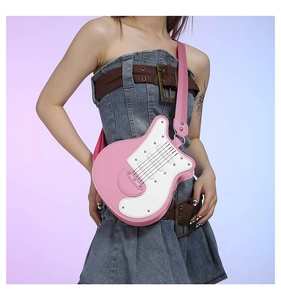 Chic pink and white guitar-shaped crossbody bag worn by a model in a trendy studio shot