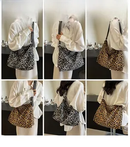 Detail of leopard print canvas tote bag showing two colors and versatile carrying styles