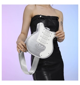 Detail of creative guitar-shaped shoulder bag with silver leather and fabric strap