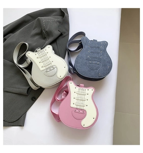 Guitar shaped crossbody bags in three colors featuring metallic studs and guitar strings
