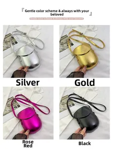 Detail view of glossy shell saddle bags in silver, gold, rose red, and black metallic colors