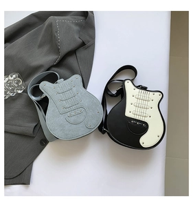 Detailed top view of guitar-shaped crossbody bags in light blue and black-white leather