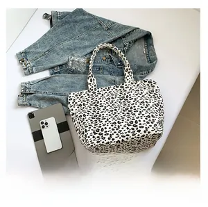 Detailed comparison showing large capacity leopard print tote bag with tablet and phone