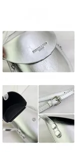 Detail view of metallic silver saddle bag showing textured leather and magnetic closure