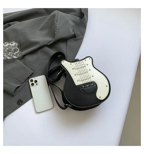 Top view of a creative guitar-shaped crossbody bag with black and white PU leather details