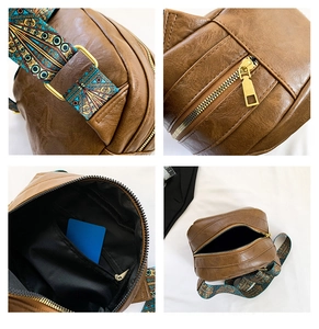 Detailsicht der braunen PU-Muscheltasche mit Vintage-Reißverschluss und buntem Gurt