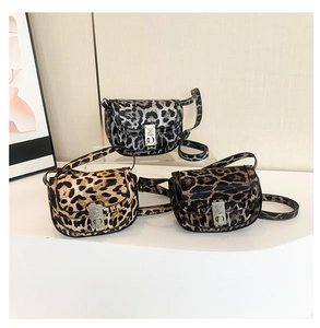 Detailed comparison of three leopard print saddle bags in black, yellow and brown tones