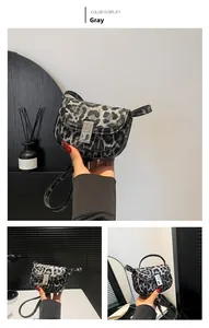 Detailed views of gray leopard print saddle bag with silver buckle and thin shoulder strap