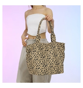 Detailed view of leopard print canvas tote bag with thick handles for daily use