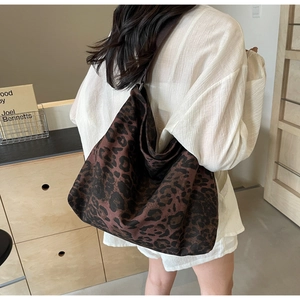 Close-up of leopard print canvas tote showing the premium fabric texture and large capacity