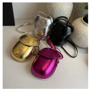 Metallic finish saddle crossbody bags in purple, gold, silver, and black displayed together