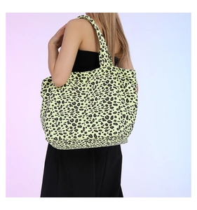 Detailed back view of a fluorescent leopard print canvas tote bag with wide shoulder straps
