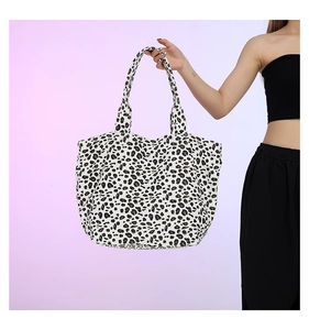 Detail view of the leopard print tote bag with large capacity and durable double handles