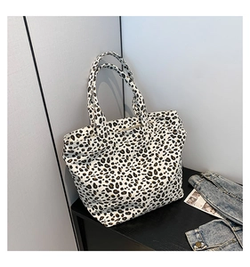 Detail of high-density canvas tote bag with classic black and white leopard print design