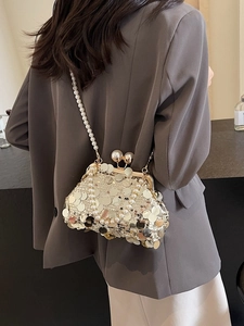 Elegant champagne sequin evening bag with pearl strap and vintage clasp closure