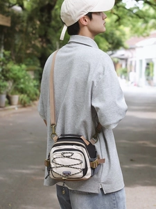 Minimalist outdoor techwear crossbody bag with beige and black mesh drawstring panel