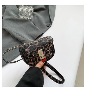 Detailed view of leopard print crossbody bag with gold metallic clasp and PU leather texture
