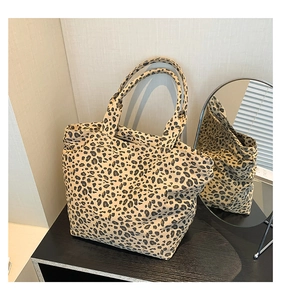 Detailed view of leopard print tote bag with durable fabric and double handles