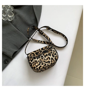 Detailed view of the leopard print mini shoulder bag with an adjustable slim strap