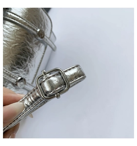 Detailed close-up of metallic silver crackle leather strap with a polished square buckle