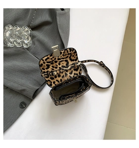 Top view of leopard print underarm bag interior showing zipper pocket and magnetic buckle