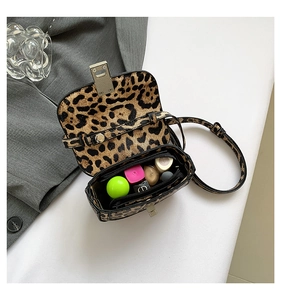 Macro shot of the mini leopard print shoulder bag showing internal zipper pocket detail