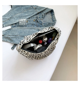 Top view of leopard print tote bag interior showing large capacity and daily essentials