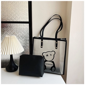 Detail view of large transparent PVC tote bag with cute panda print and black makeup pouch