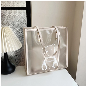 Close-up of a large capacity waterproof PVC clear bag with a cartoon bear design