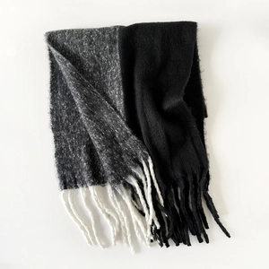 Detailed view of bicolor black and grey mohair scarf with fringe trim texture