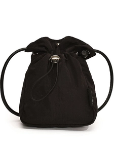 Minimalist black nylon drawstring bucket bag with slim shoulder strap and silver hardware