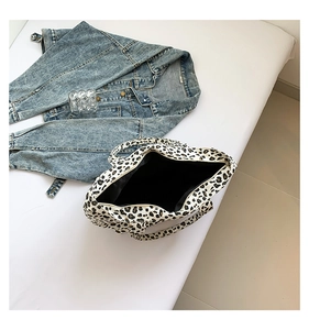 Detail of leopard print tote bag with thick fabric texture and interior lining