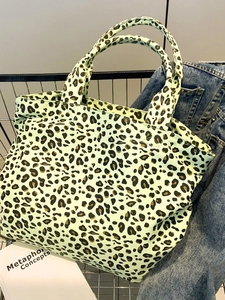 Japanese style leopard print canvas tote bag in green with double handles in a shopping cart